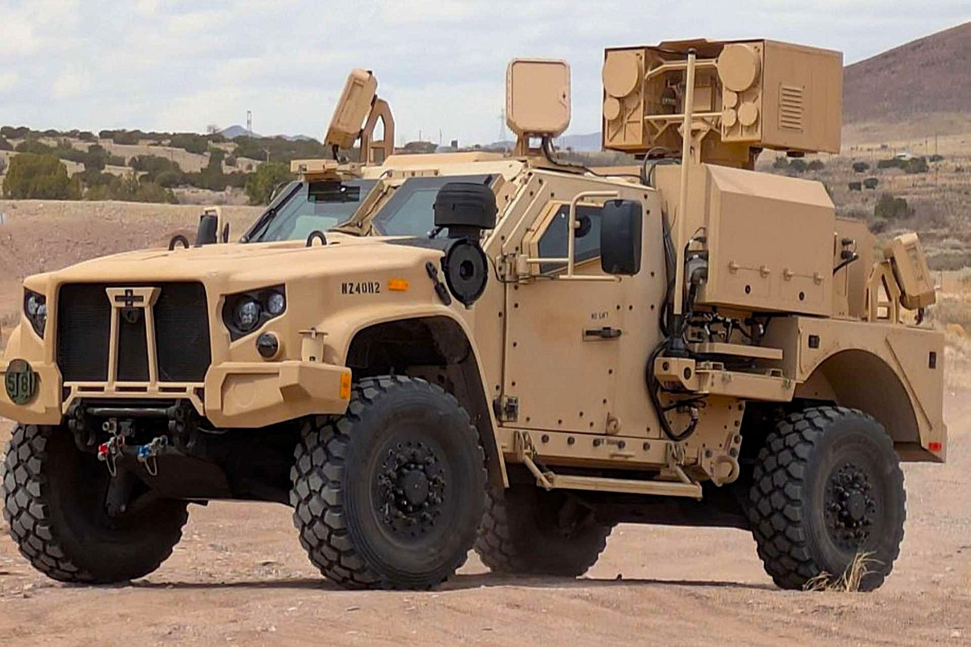 www.armyrecognition.com-templates-yootheme-cache-57-_u.s._army_takes_delivery_of_first_jltv-mounted_locust_high-energy_laser_counter-drone_system-57a779b4.jpeg