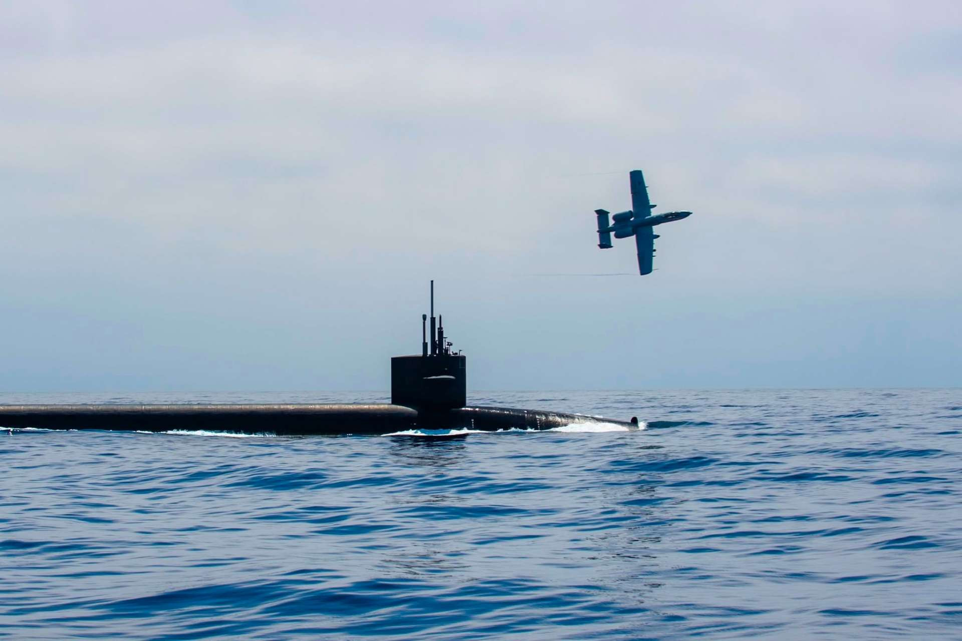 www.armyrecognition.com-images-stories-news-2026-august-_u.s.-a-10-escort-of-nuclear-submarine-uss-nebraska-signals-a-new-response-to-pacific-maritime-threats.jpg