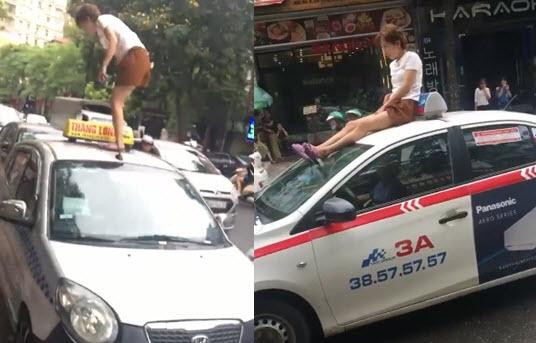 Chân dài leo lên nóc taxi ở Hà Nội, ném tiền và phản ứng bất ngờ của người dân