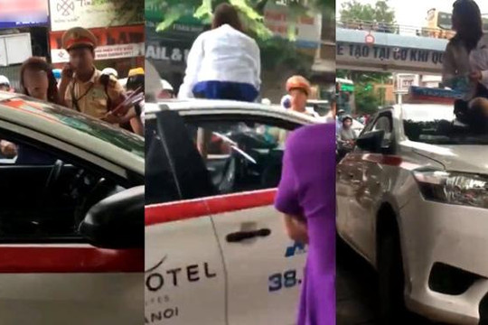 Bị CSGT Hà Nội thổi phạt, nữ tài xế taxi mặc váy lên nóc xe chửi bới