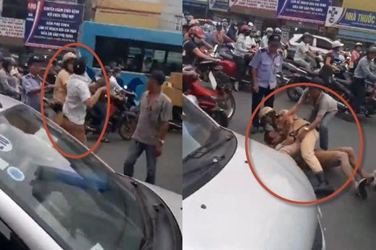 Clip CSGT Hà Nội quật ngã tài xế taxi giữa đường vì bị gạt tay