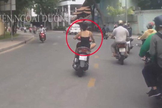 'Hot girl' không đội mũ bảo hiểm, chạy xe lạng lách giữa đường phố Sài Gòn