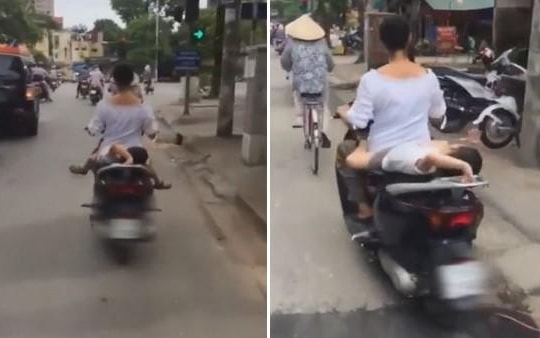 Hoảng hồn cảnh mẹ đầu trần chở con nhỏ nằm ngửa trên xe máy