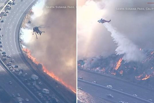 Clip trực thăng dập đám cháy rừng mở đường cho ô tô qua cao tốc ở Mỹ