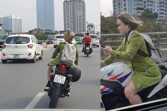 Kiều nữ đầu trần chạy mô tô lạng lách và dùng ĐTDĐ đối mặt án phạt nguội