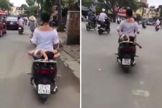 Thót tim cảnh người phụ nữ chở bé trai nằm dài sau xe máy