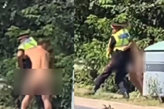 Clip gã đàn ông khỏa thân trên phố quật ngã cảnh sát khi bị bắt quấn chăn