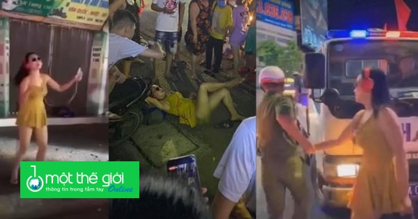 Clip cô gái mặc váy ngắn đeo kính đen nhảy và nằm trên vỉa hè bị công an bắt